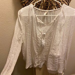 long-sleeve white top with lace detail
